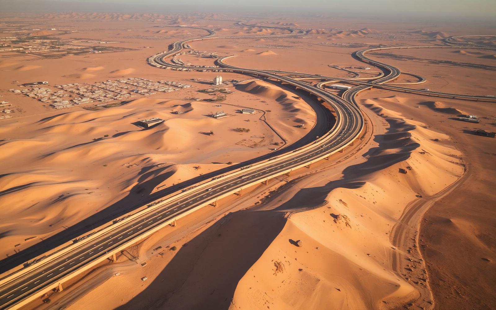 Aerial view of a new road corridor crossing the desert edge of Cairo